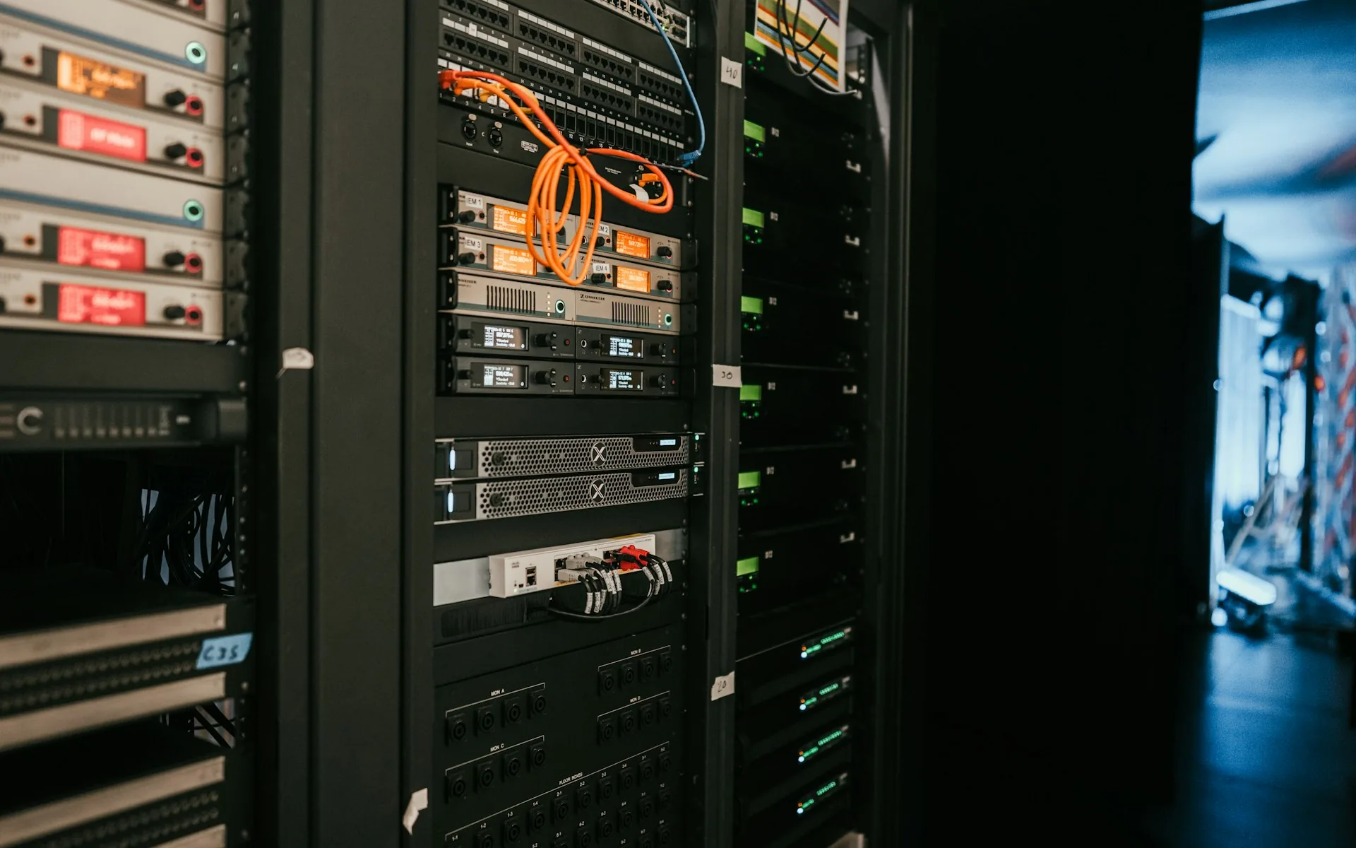A rack of servers in a data center, representing scalable web application infrastructure