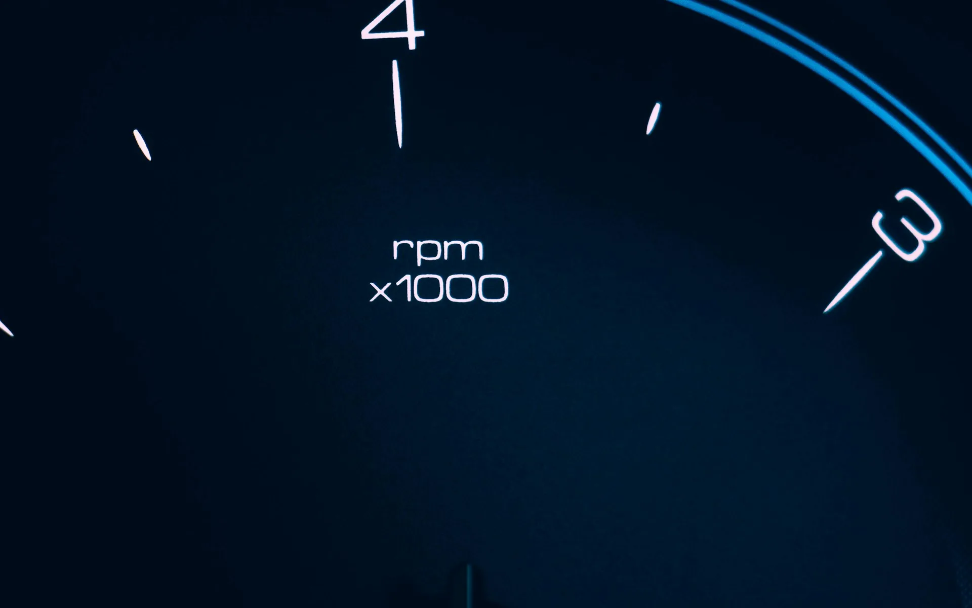 A car speedometer needle, representing website speed optimization